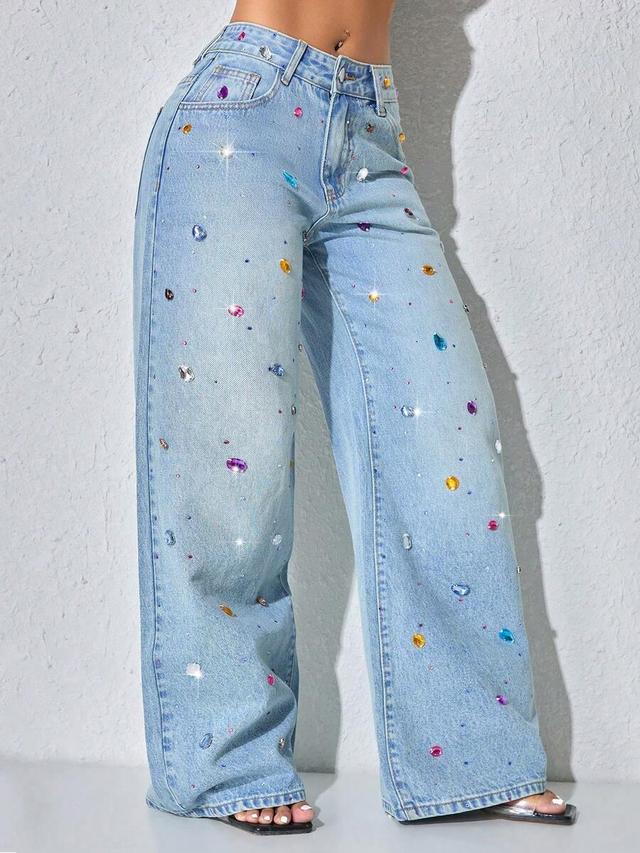 light wash denim jeans with colorful crystal embellishments