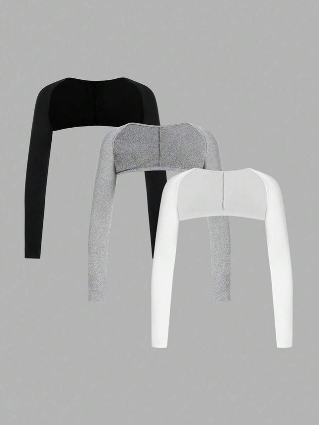 white three piece set of black grey and white shrugs