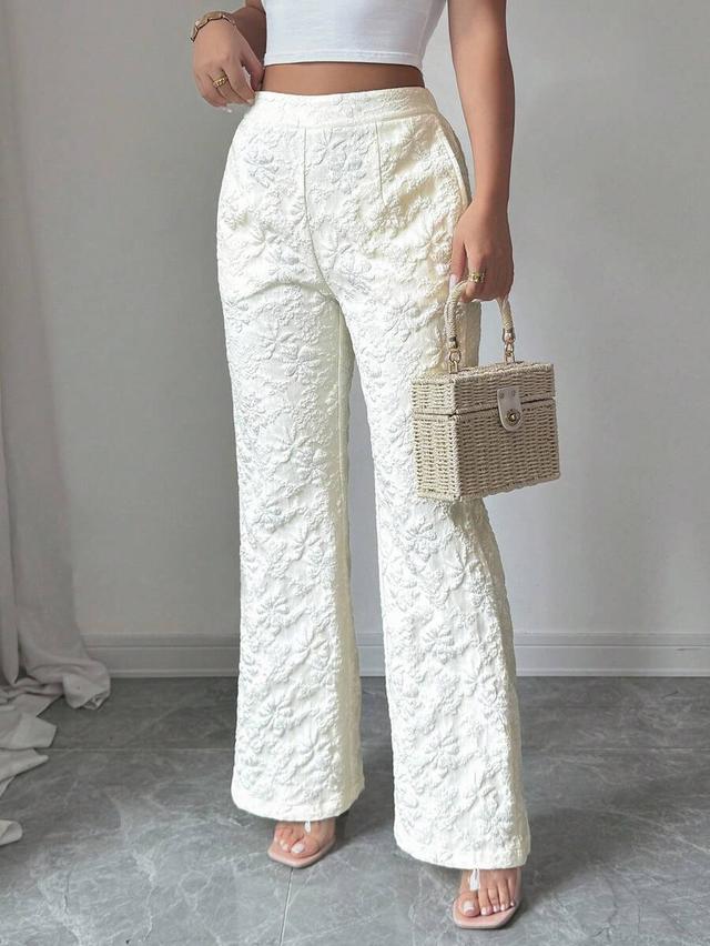 white floral jacquard textured flare trousers