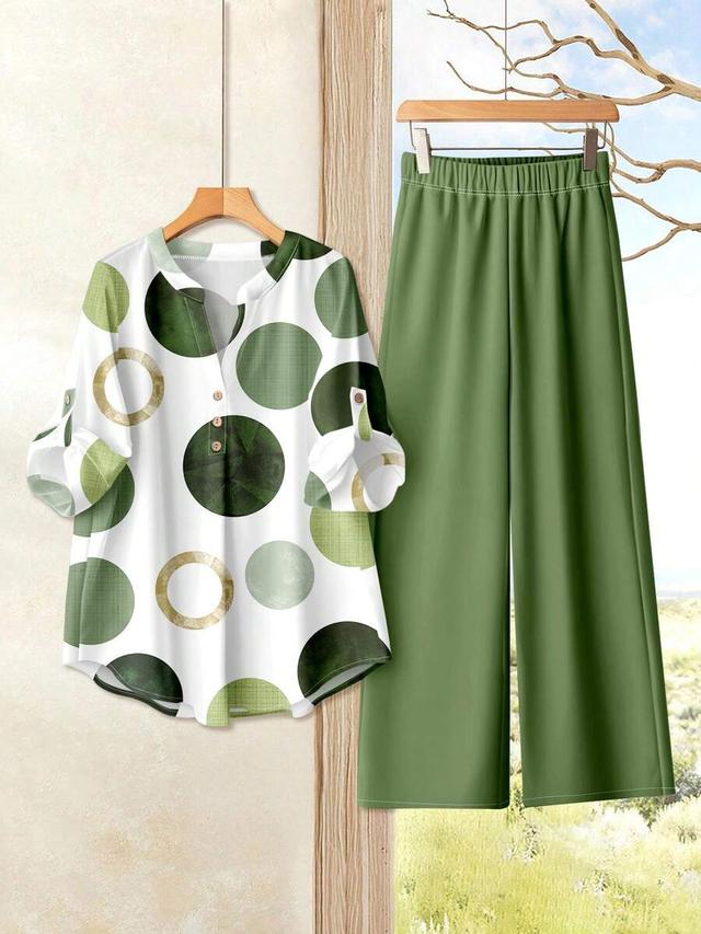green polka dot v-neck blouse and straight pants