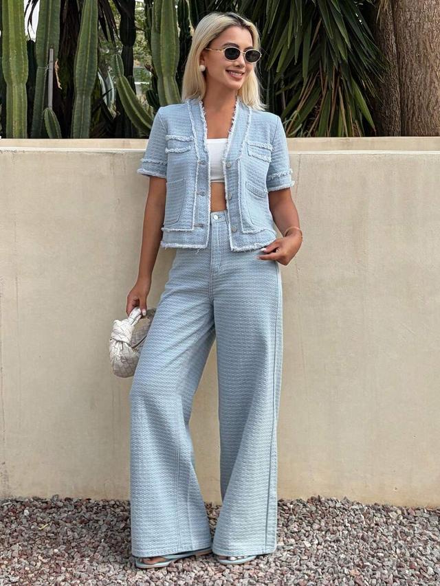 textured light blue tweed short sleeve cardigan and jeans