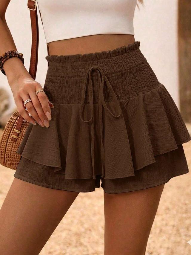 wavy textured fabric waist tie ruffle hem shorts