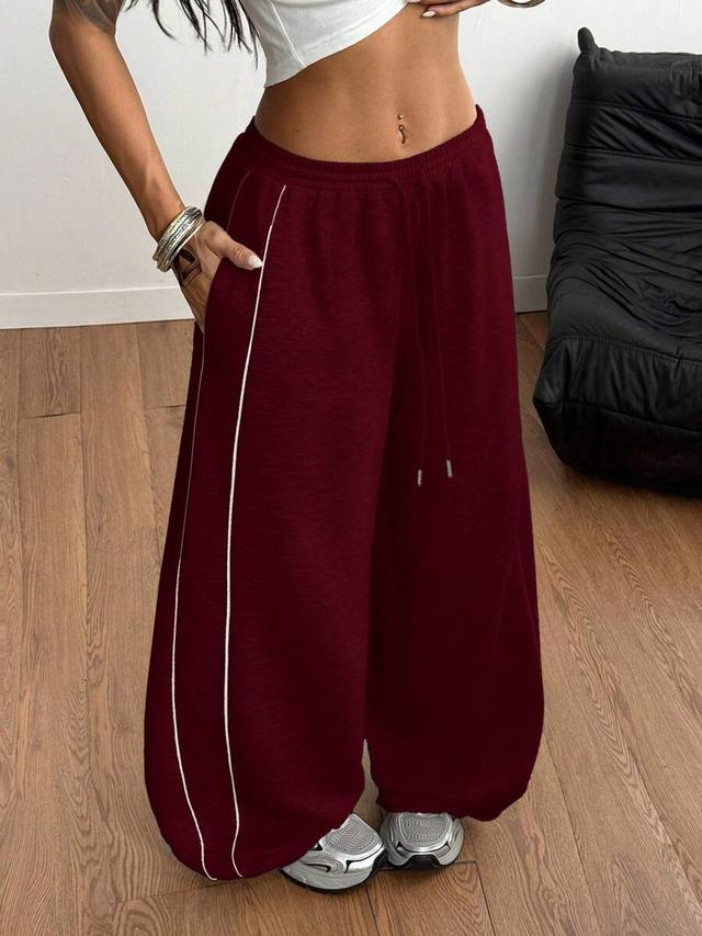 burgundy wide leg athleisure sweatpants with side piping