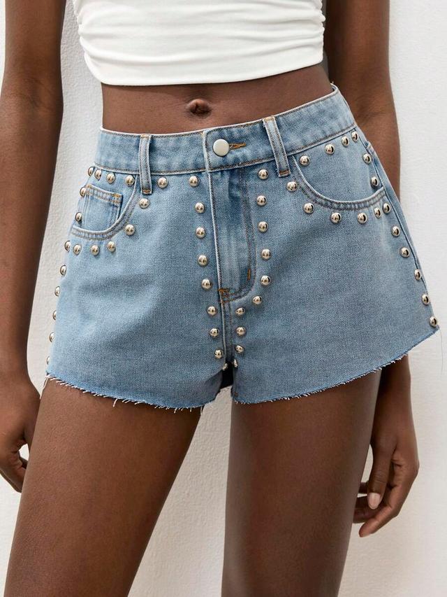 light wash denim shorts with silver stud detailing
