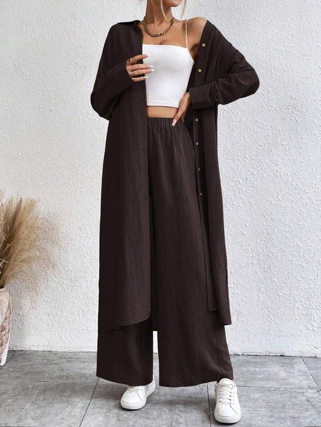dark brown longline button-up shirt and wide-leg trousers