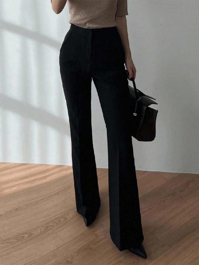 black high-waisted flared dress pants