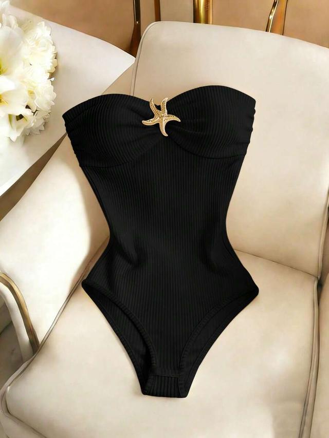 black ribbed strapless bodysuit with starfish buckle