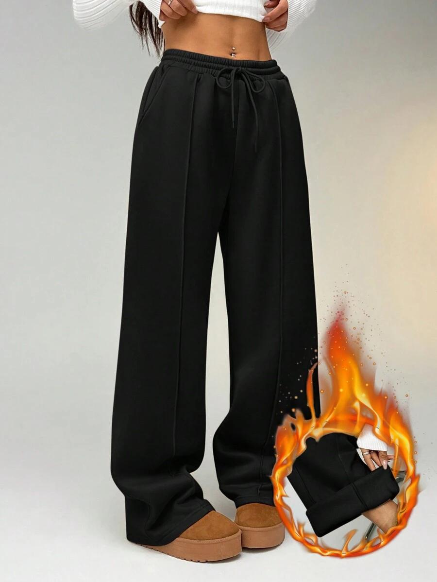 black straight leg sweatpants with seam detail