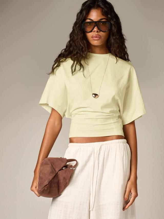 pale yellow ruched cinched crop top with flutter sleeves