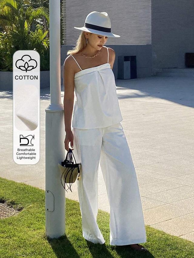 white pleated camisole top and straight leg pants