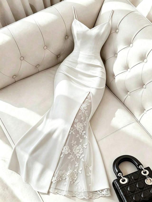 white satin floor length gown with floral lace slit