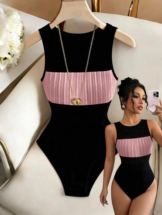 black and pink sleeveless twist detail slim bodysuit