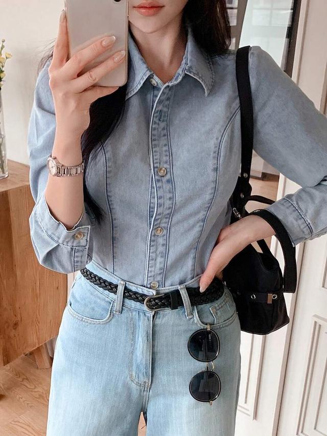 light wash blue collared denim button-up shirt