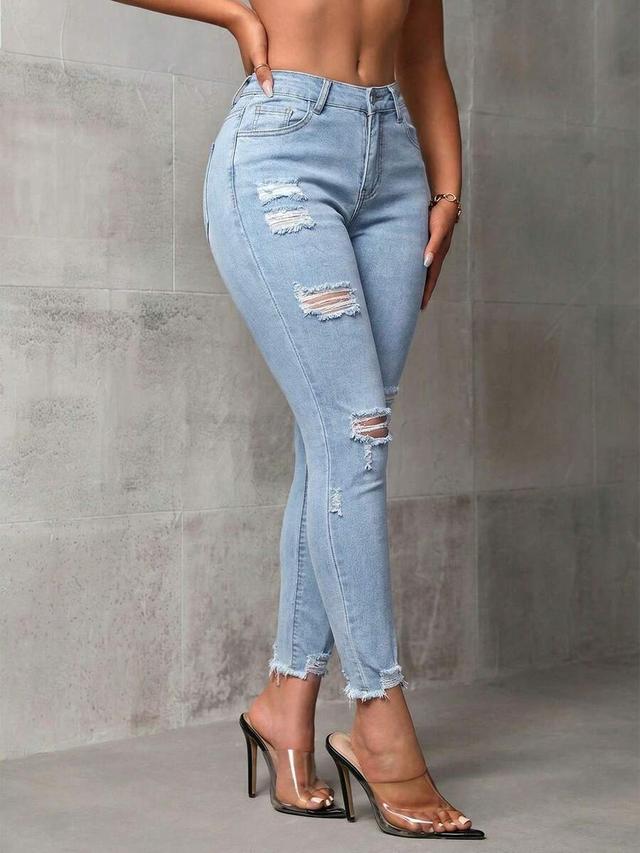 light blue icon ripped and fringed skinny jeans