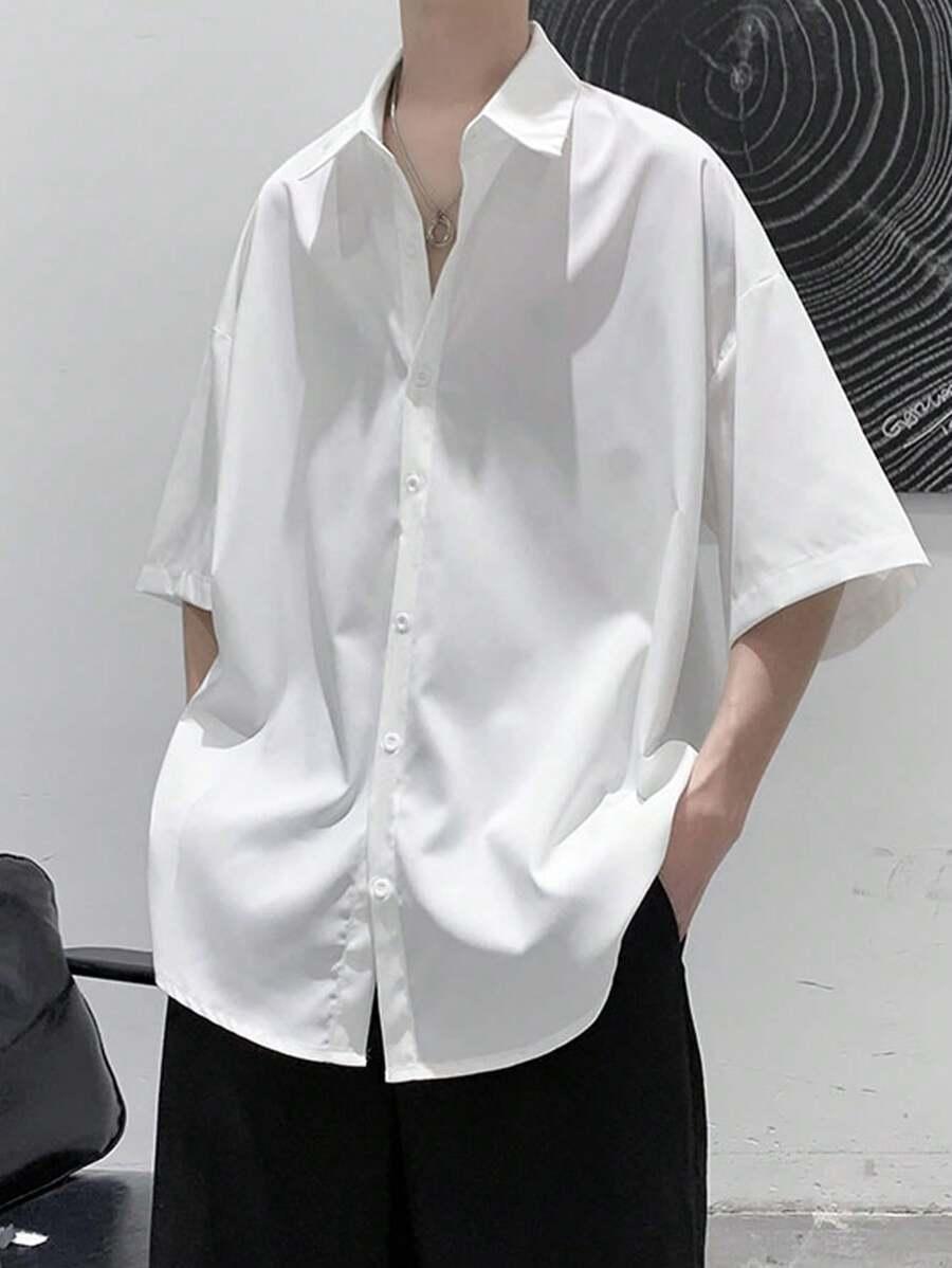 white oversized short sleeve button-down shirt