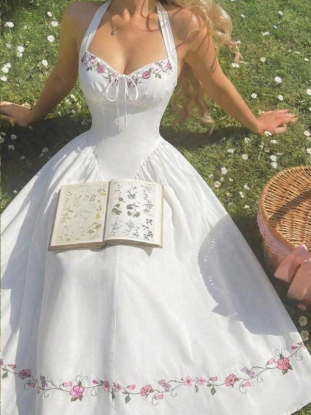 white halter dress with floral embroidery