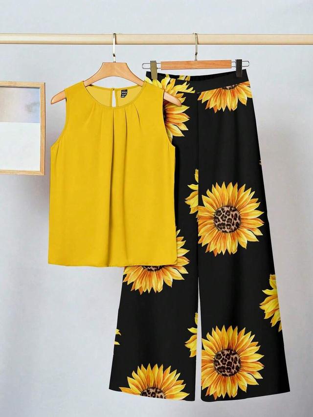 yellow sleeveless top and sunflower print wide leg trousers