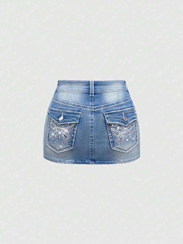 light wash denim mini skirt with butterfly embroidery