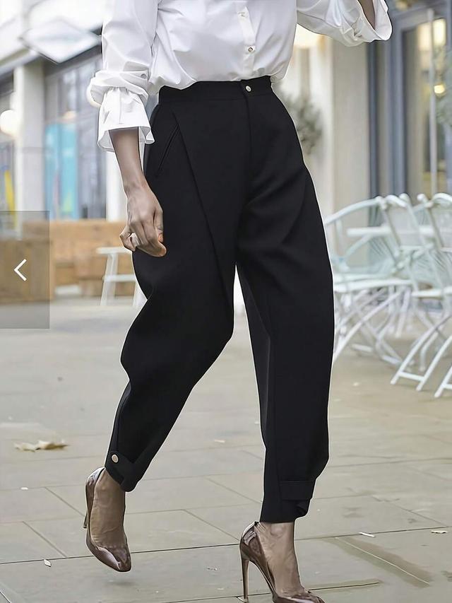 solid black tailored trousers with front pleat detail
