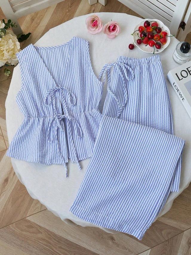 blue and white striped sleeveless tie-front peplum top