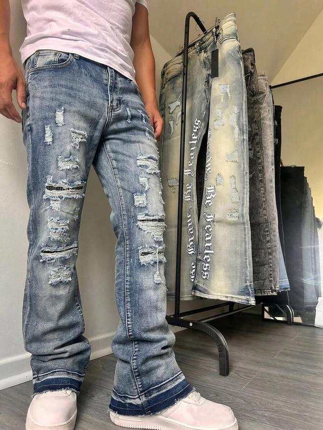 very light blue distressed flare leg denim jeans