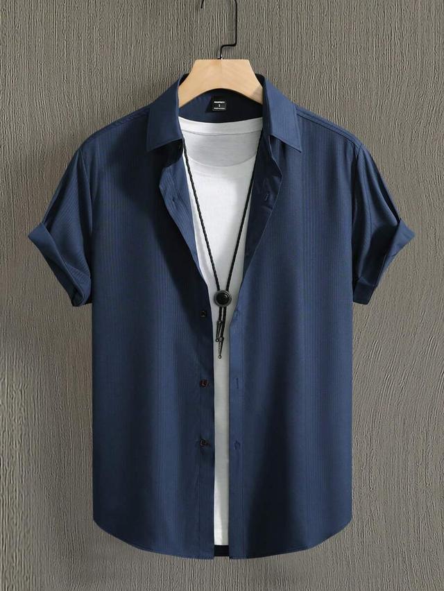 navy blue textured short sleeve button down shirt