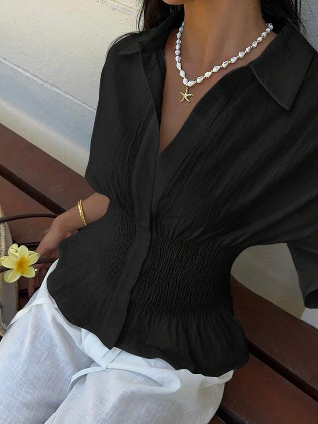 black woven front button short sleeve smocked waist blouse