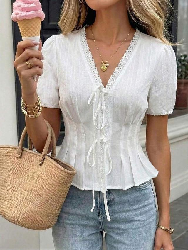 white v-neck gathered waist blouse with lace trim