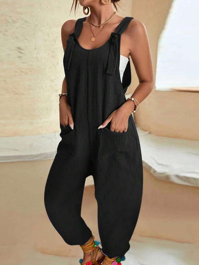 black textured cotton sleeveless jumpsuit with tie straps