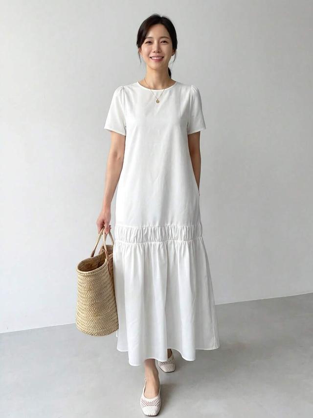 white cotton round neck short sleeve ruffle hem dress