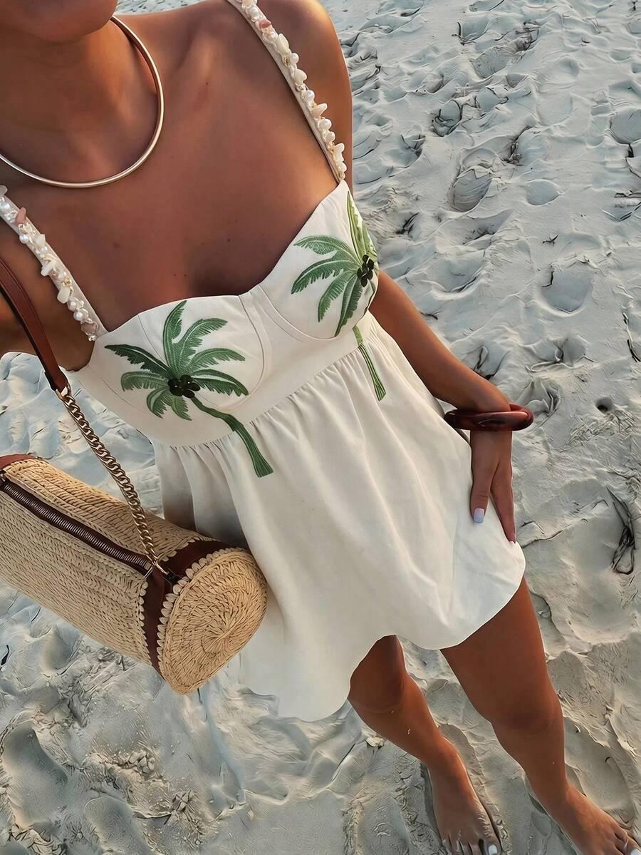 white linen mini dress with tropical palm embroidery