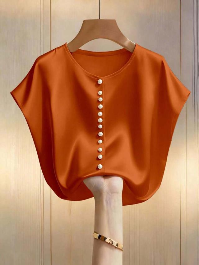 burnt orange satin batwing blouse with pearl buttons