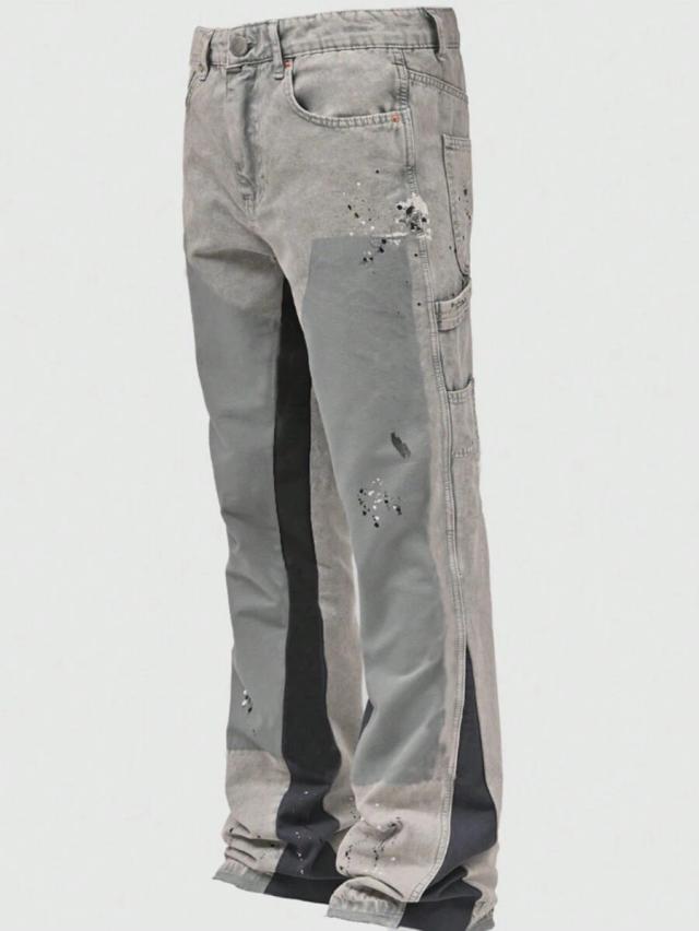 color-blocked straight-leg casual jeans with paint splatter