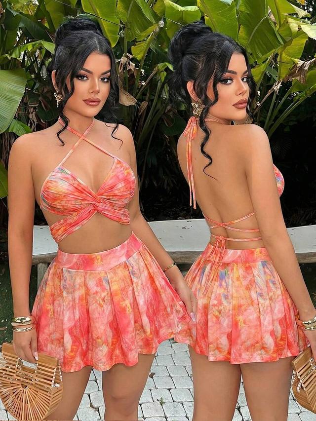 pink and orange tropical print halter top and skirt set
