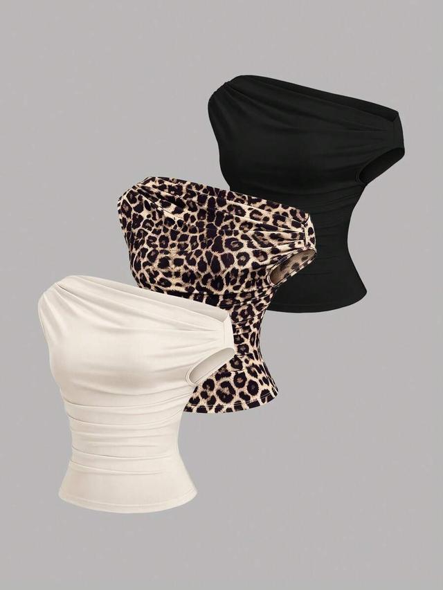 black three asymmetric ruffle top in black, leopard, and cream