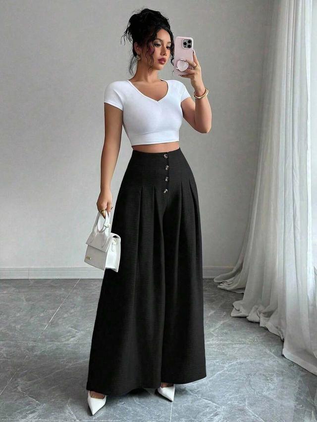 black high-waisted wide-leg pleated trousers