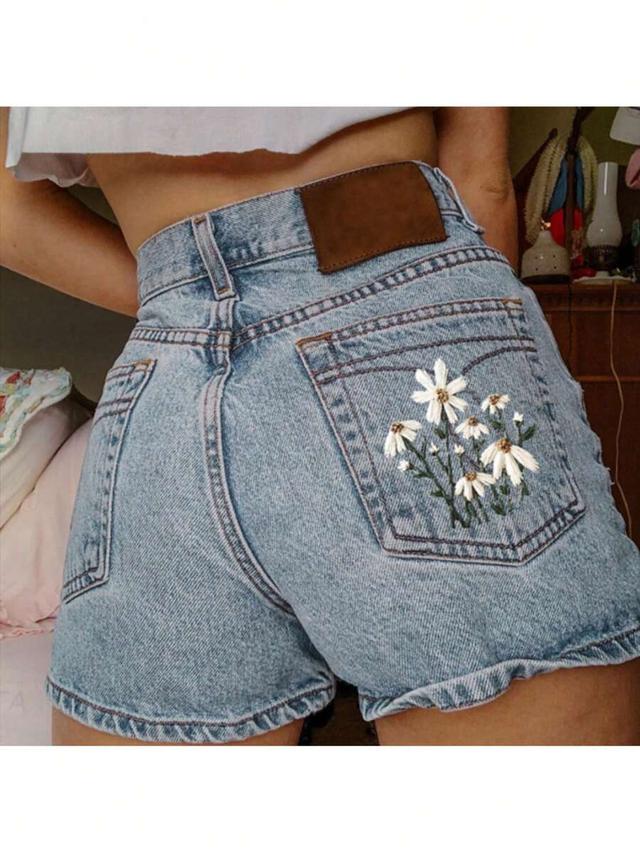 high waisted light wash denim shorts with floral embroidery