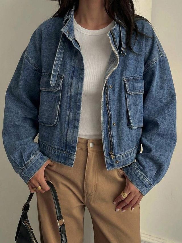 oversized blue denim utility jacket with flap pockets