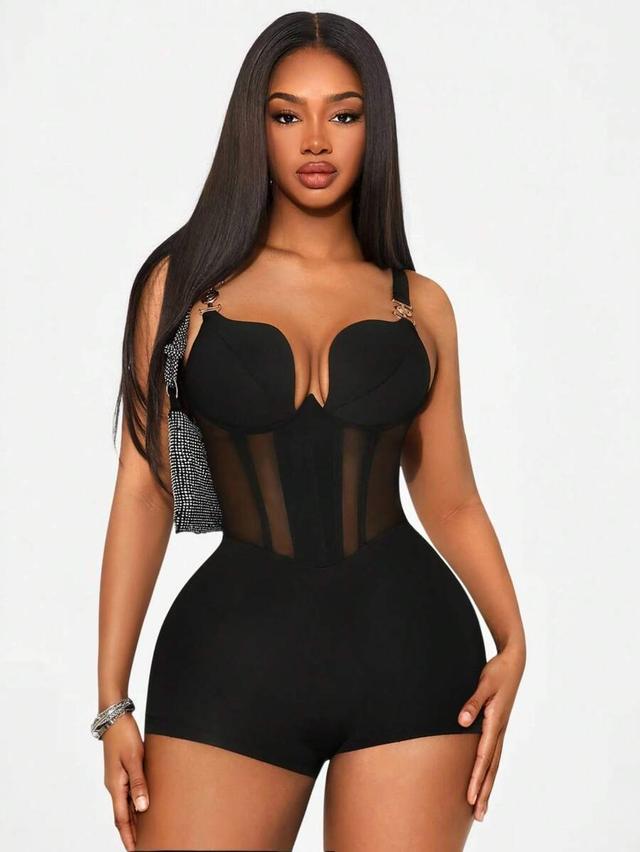 black knitted sleeveless jumpsuit with sheer mesh panels
