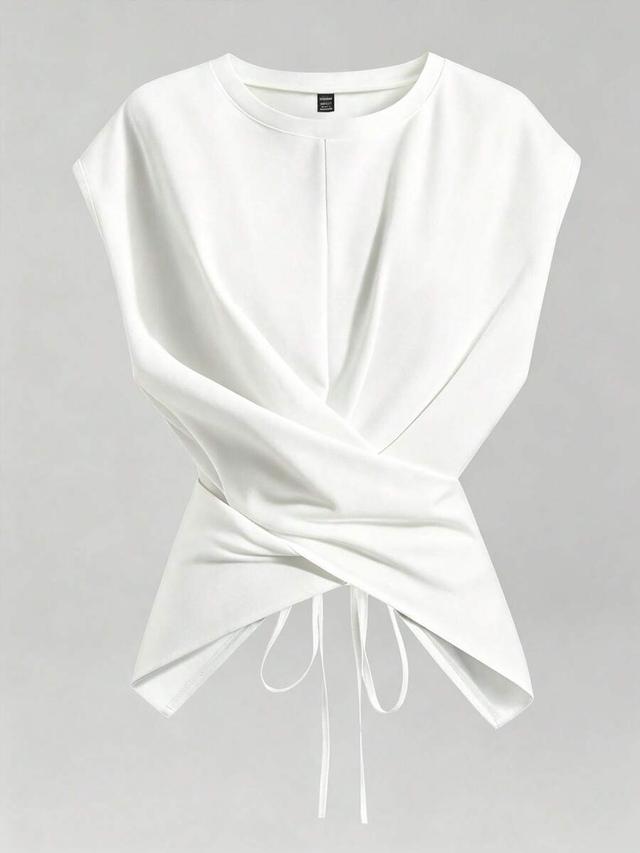 white sleeveless cropped asymmetric twist knot waist blouse