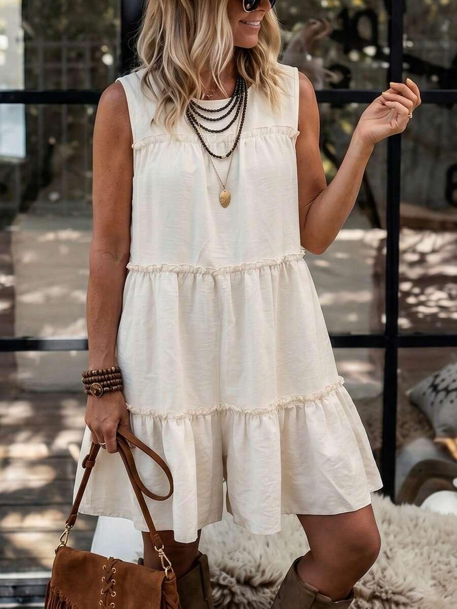 cream textured woven sleeveless tiered ruffle cake dress