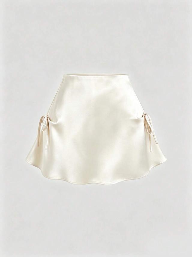 cream satin mini skirt with side bow details