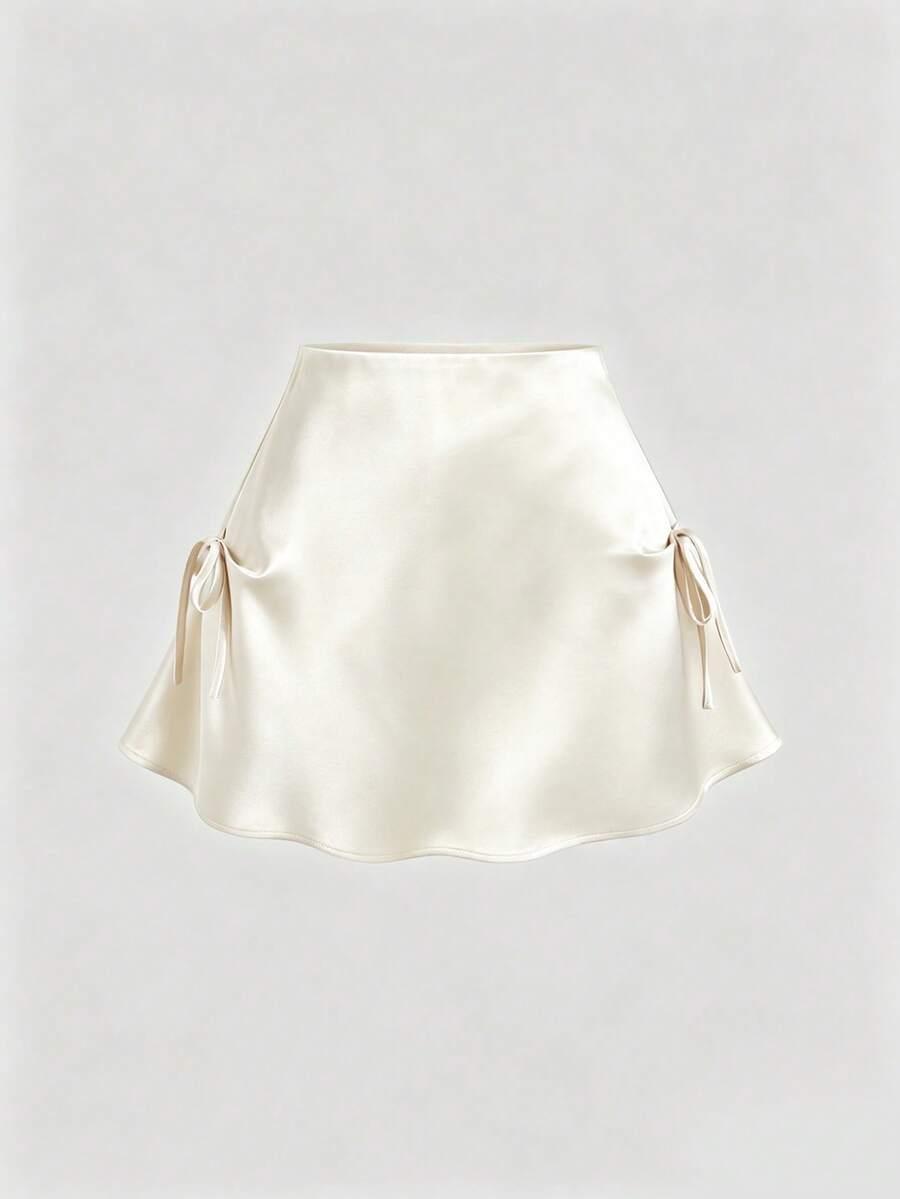 cream satin mini skirt with side bow details