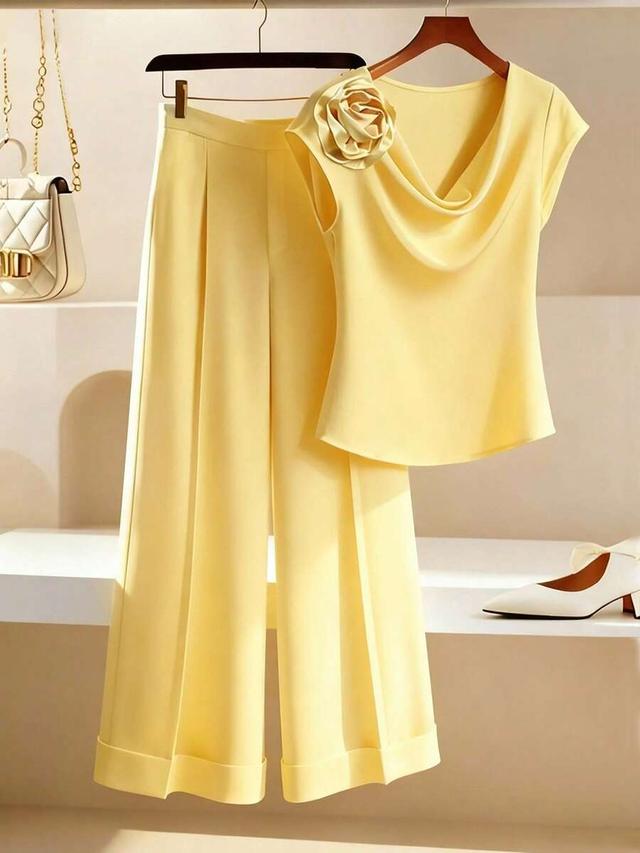 yellow draped neck blouse with 3d flower shoulder decor