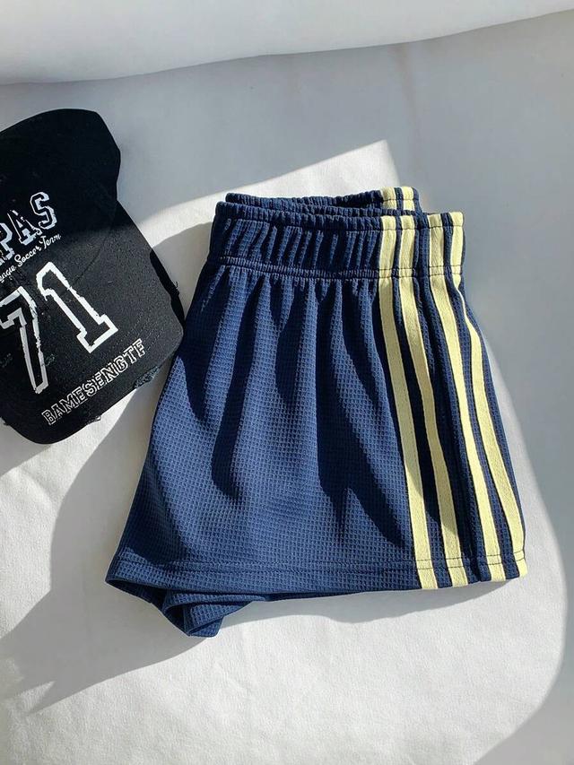 navy blue waffle knit athletic shorts with side stripes