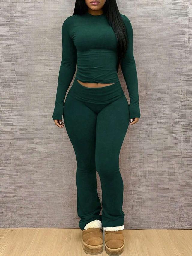 dark green long sleeve fitted top and trousers set