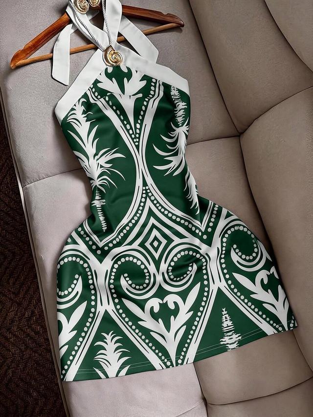 green and white printed halter mini dress