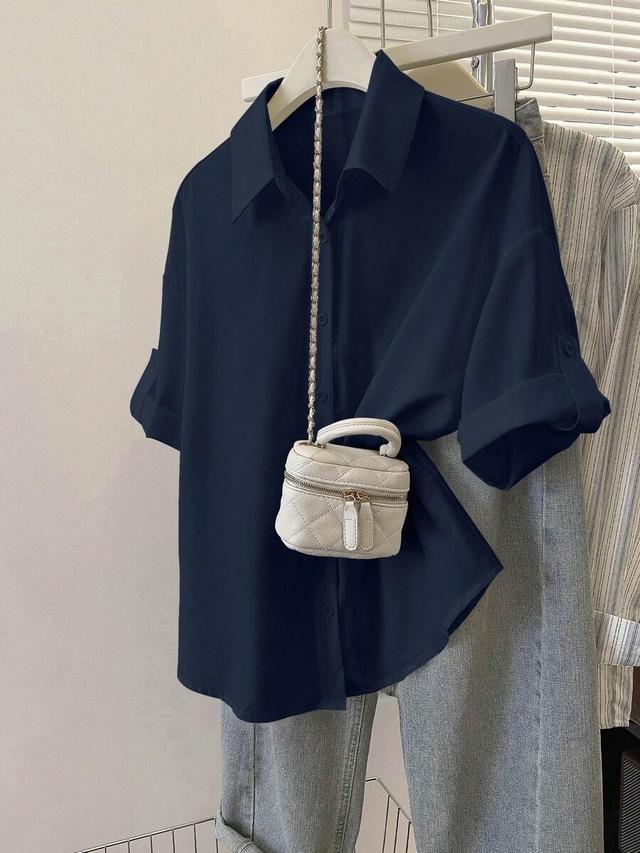 minimalist navy blue button-up shirt