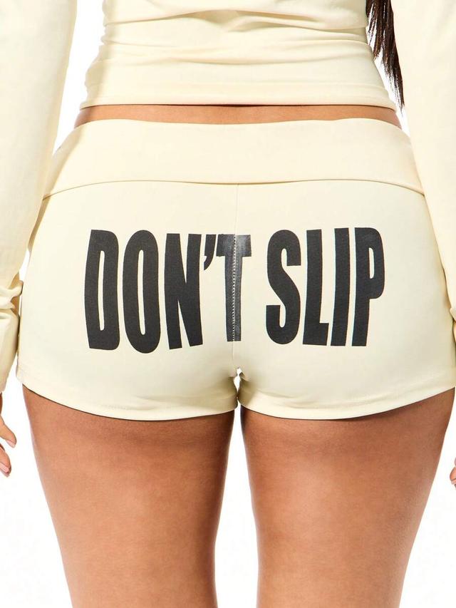 cream fold over waistband booty shorts with motivational print
