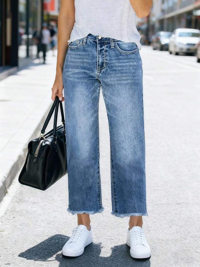 medium wash denim jeans with raw hem